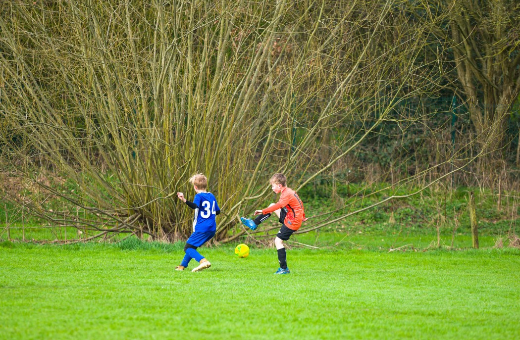Kids playing football
